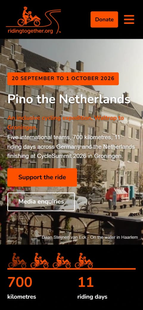 The Riding Together campaign page on a phone: the ride’s dates and “Pino the Netherlands” over a canal street, with the start of the stats bar.
